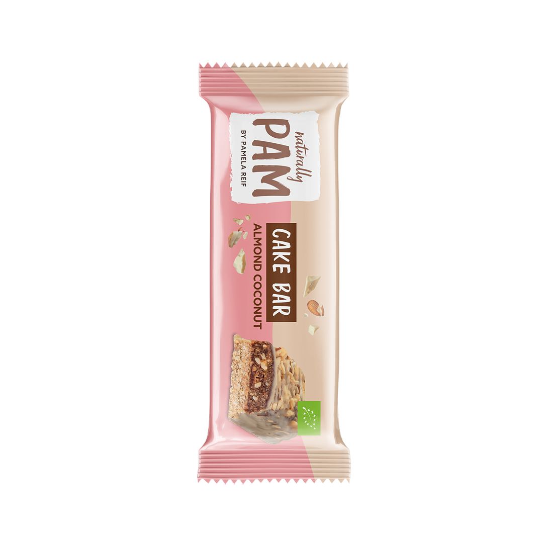 Natürlich Pam Cake Bar mit Mandeln und Kokosnuss, einzeln verpackter Riegel, zeigt die cremige Textur und die Zutaten.
