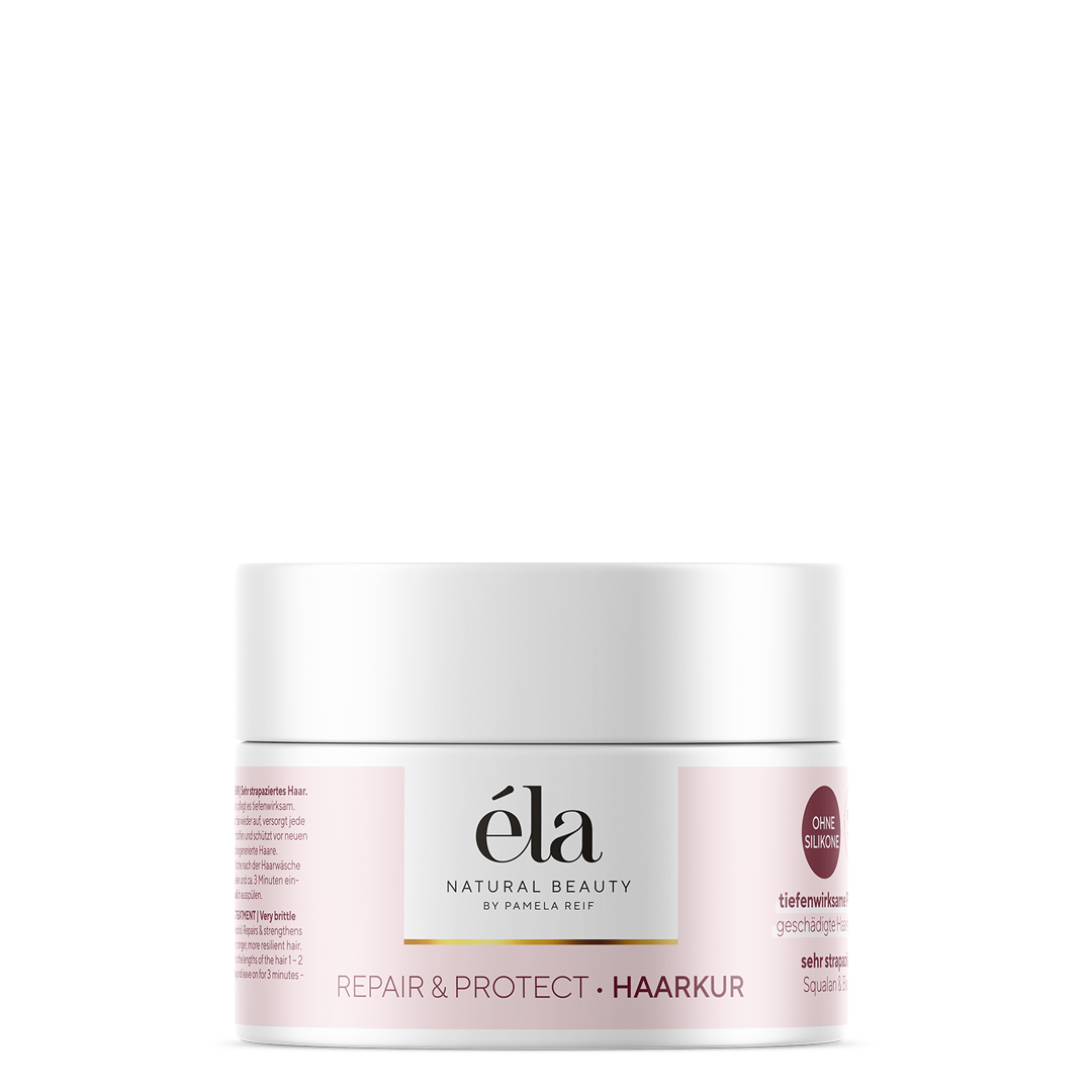 Natürliches Éla Natural Beauty Haarkur in einer weißen Dose, sichtbar mit cremiger Textur für gesundes Haar.