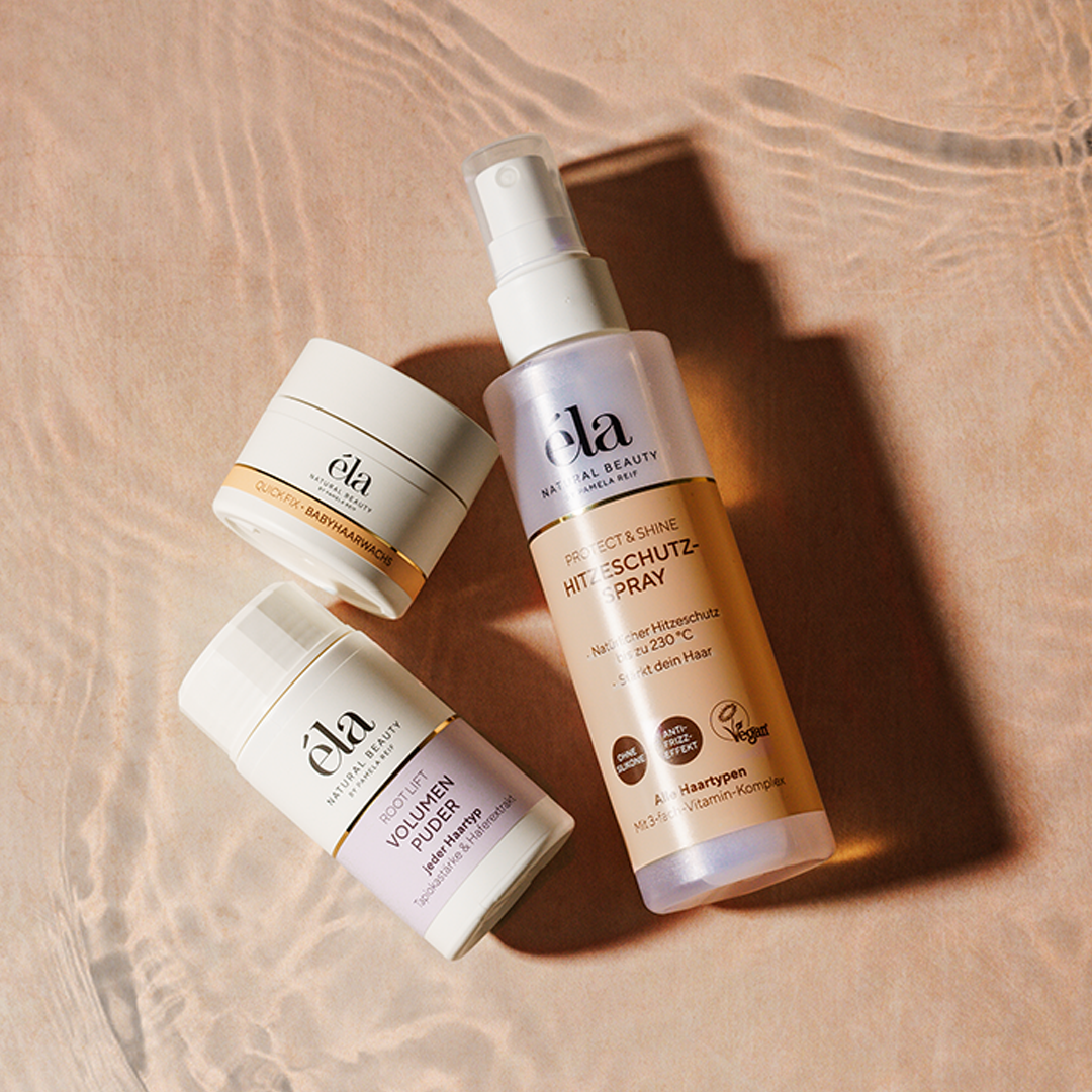 Natürliches Hitzeschutzspray von Naturally Pam, éla Natural Beauty, mit Sprayflasche und Anwendung auf gestyltem Haar sichtbar